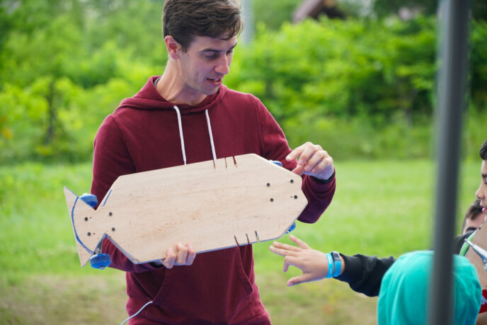 Tim King Ed Venture Holding A Handmade Skateboard