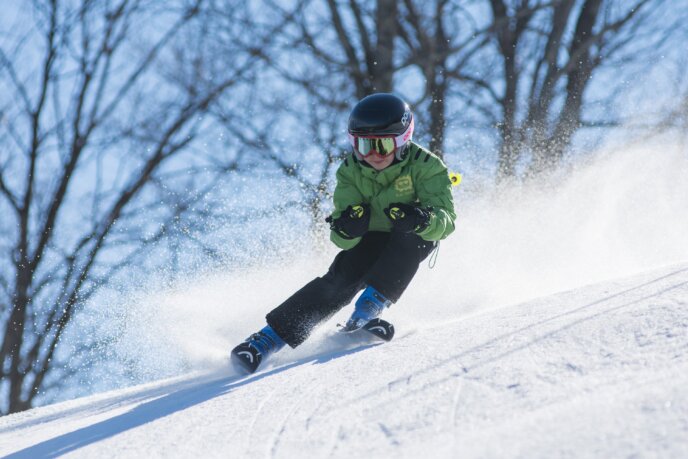 Boy Skiing In Spring