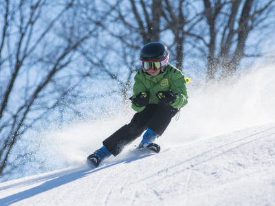 Boy Skiing In Spring