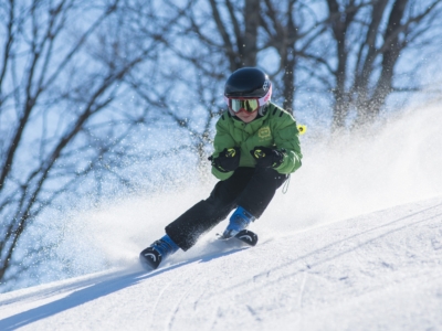 Kid skiing in spring